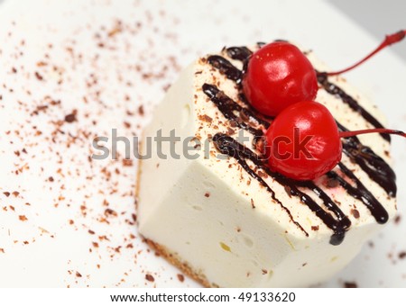 Tasty baking celebratory fancy cake with cherry