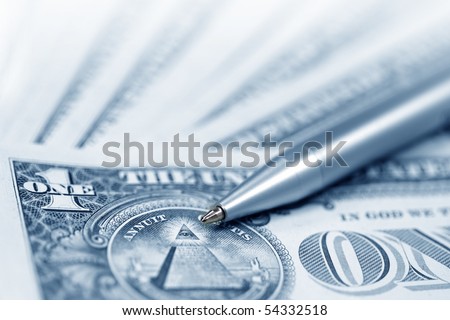 The American money dollars. Bundle of bank notes  and pen