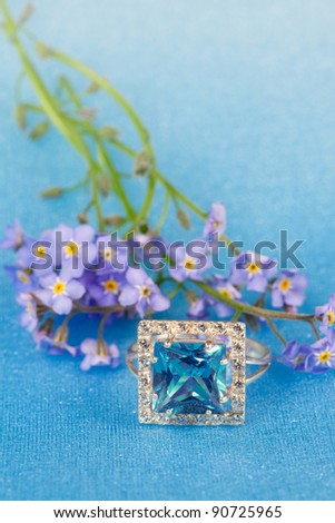 Elegant jewelry ring with spring natural flowers forget-me-not