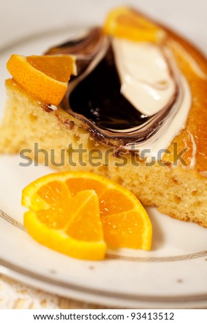 Tasty baking celebratory fancy cake  with orange