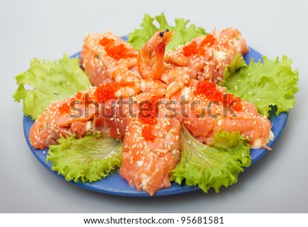 Salad with salmon fish and red salmon caviar