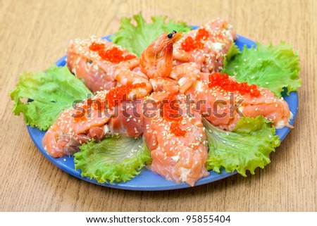 Salad with salmon fish and red salmon caviar