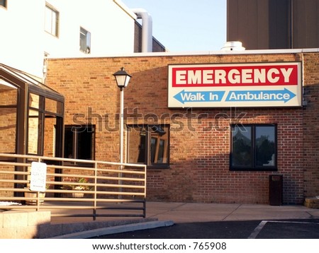 Emergency entrance sign for walkins and ambulances shot in natural light.