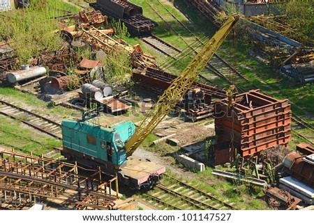 Train crane railcar. Hydraulic crane mounted on a railroad car (freight train)