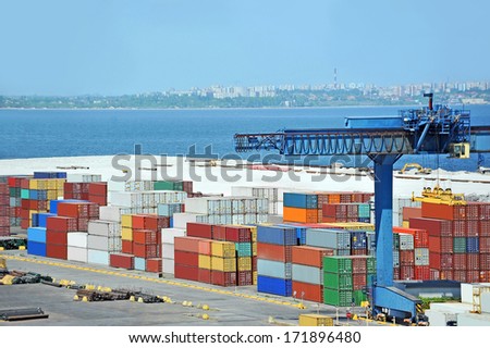 Port cargo crane and container over blue sea background Port cargo crane and container over blue sea background