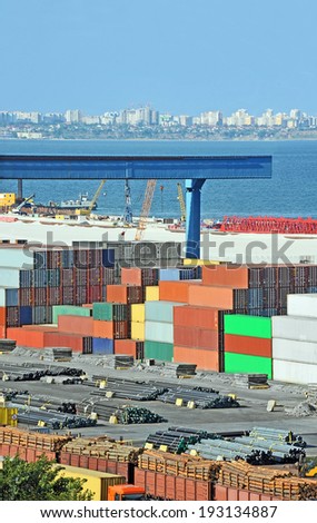 Cargo container, lumber, pipe and train in port Odessa, Ukraine