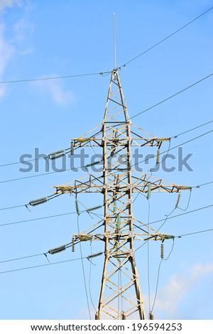 Electric lines pylon on blue sky background