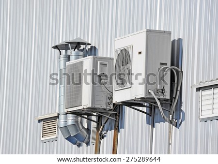 Industrial air conditioning and ventilation systems on a wall