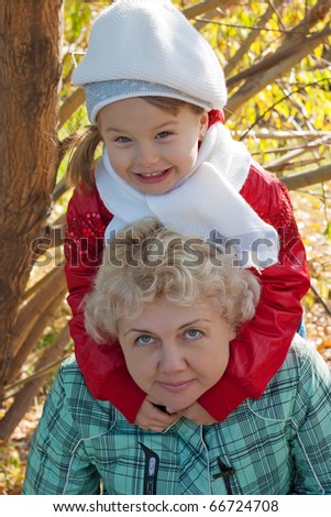 mother and daughter in autumn park