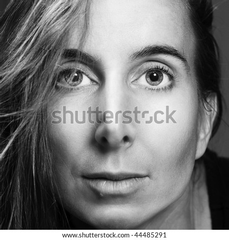 Naturally beautiful middle aged woman looking at the camera.