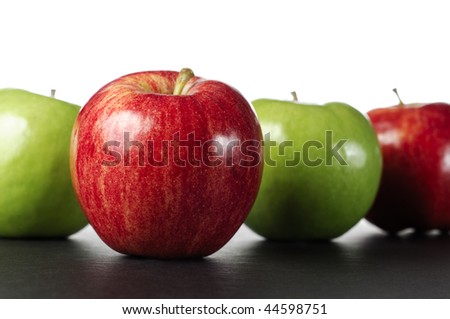 A row of apples with a Gala apple standing out.
