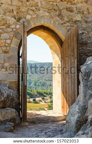 old wooden arch in the fortress with open doors