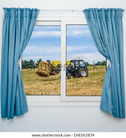tractor hay removes the view from the window with curtains