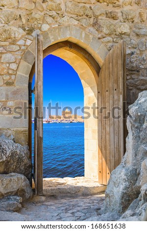 old wooden arch in the fortress with open doors