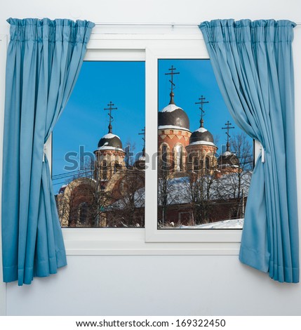 view from the window on an orthodox temple with domes