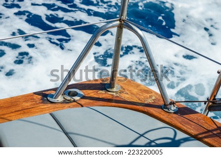 the yacht sails on the sea on a background of blue water