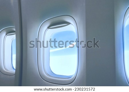 airplane porthole view into open space sky
