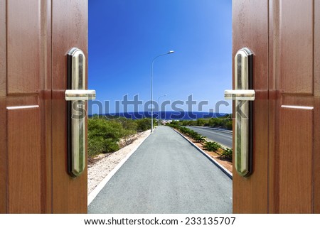 open white door with a view of the sky with the sun sky