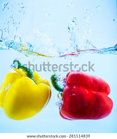 sweet pepper falling in water with splashes and drops