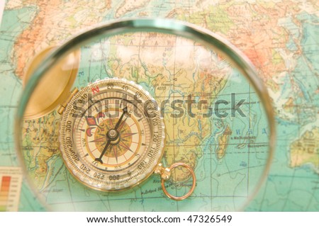 Modern compass map of the earth and magnifier