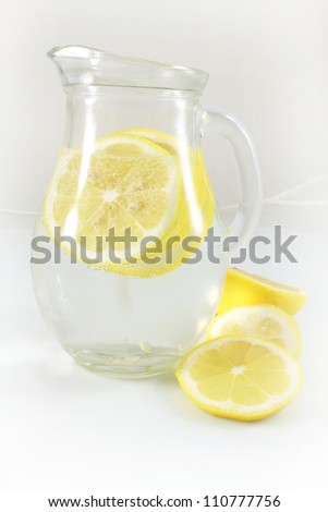 pitcher of water and  lemon