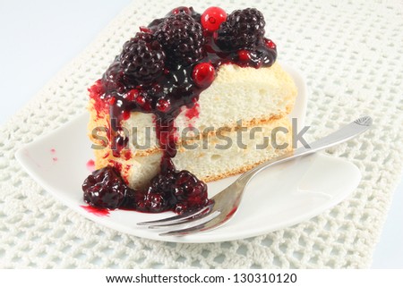 Slices of Angel Cake  topping with berry sauce