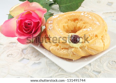 Choux pastry eclair ring with custard