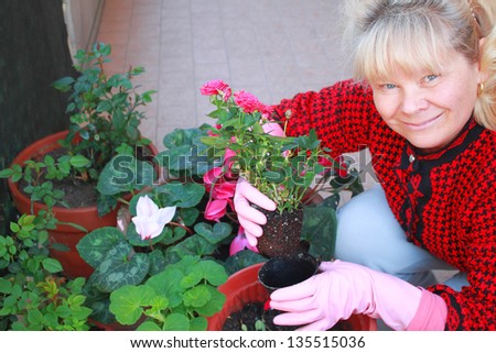 Blond woman transplant flowers