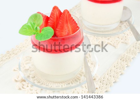 Creamy, vanilla, rice pudding with strawberries, rose water and strawberry syrup