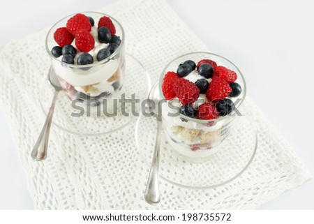 Delicious berries, greek yogurt and cookies parfaits