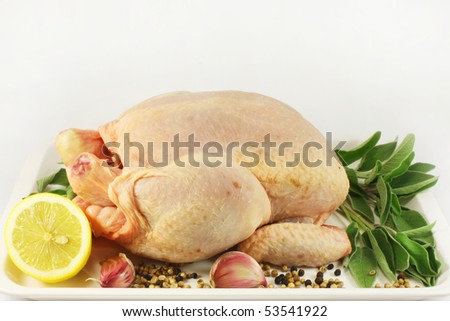 raw chicken with lemon, garlic and sage