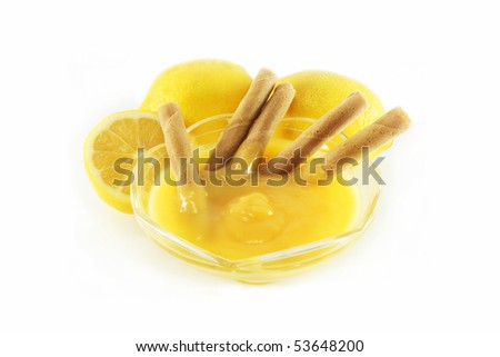 lemon curd, wafer rolls and lemons