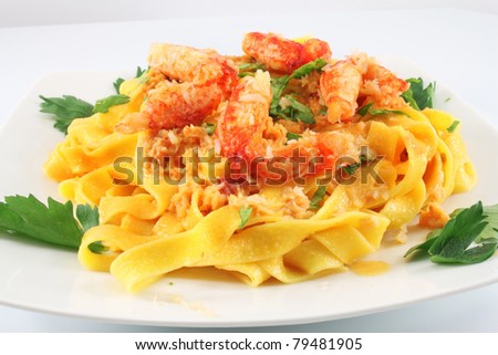 dish with Italian pasta fettuccine and crabs