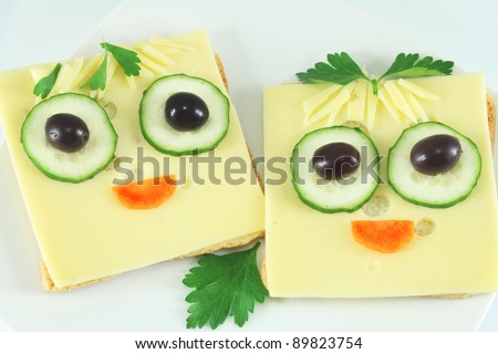 Merry sandwiches with cheese, cucumber, olives, carrot