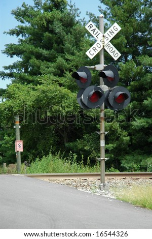 At grade railroad crossing, with warning lights