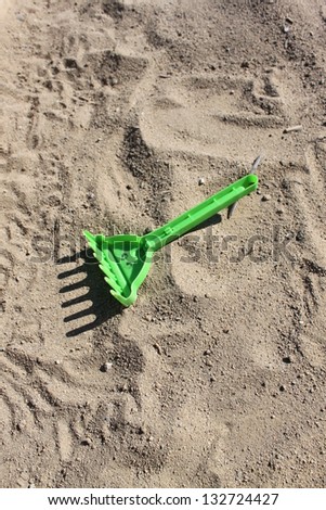 rake for children\'s play in the sand