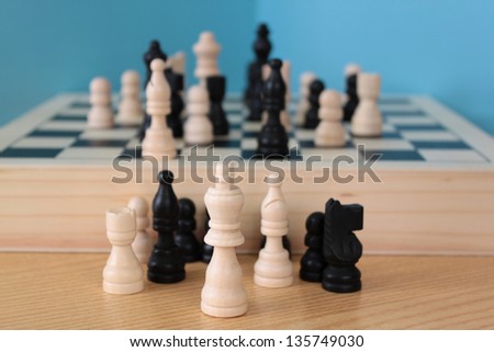 board game with wooden pawns in chess and checkers