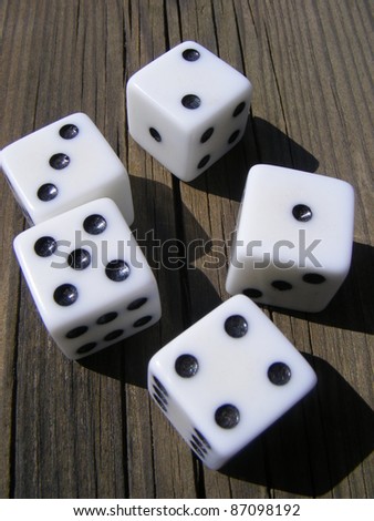 Dice game on old wooden table