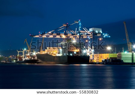 loading in the night port containers on the vessel