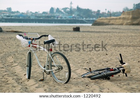 bicycle lying on the beach in Santa Cruz, California