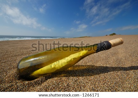 bottle with a message in it on the beach