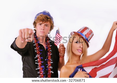 Patriotic couple dressed up with uncle Sam hats and US flag paraphanilia for the 4th of July