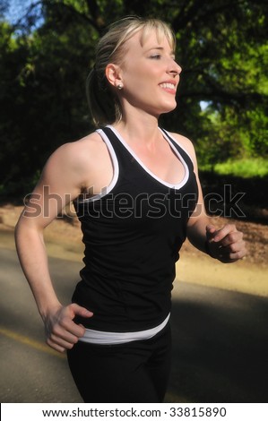 pretty athletic woman jogging at a local park