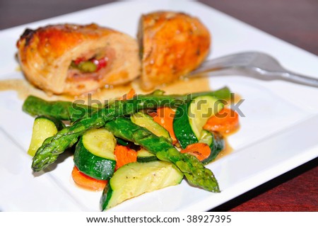 gourmet chicken dinner with cooked vegetables