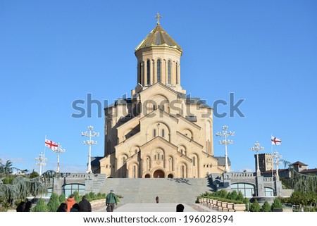 TBILISI, GEORGIA - OCT 7, 2013: believers and tourists go to the Holy Trinity Cathedral of Tbilisi (Tsminda Sameba) - one of the largest Orthodox churches in the world.