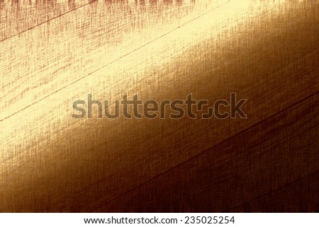 Gold metallic background, golden foil, fabric texture, bright festive background, brown paper