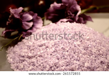 Lavender sea salt and purple tropical flower. Good as background for beauty salon certificate or spa advertising