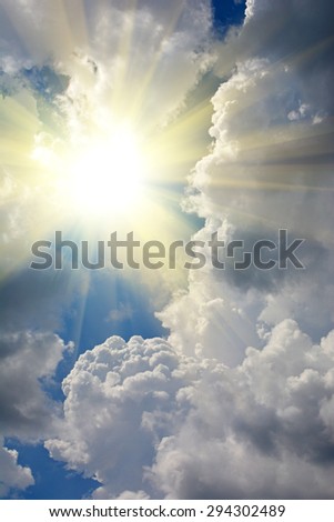 Storm clouds, sky and sun, light from above, beautiful cloudscape. Natural summer background with copy space