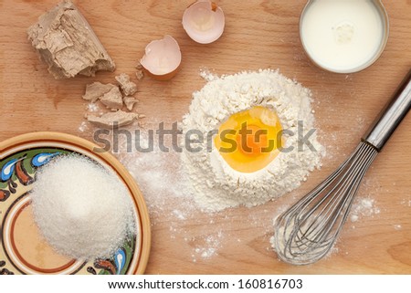 composition with eggs, milk, sugar and flour