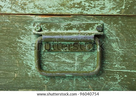 the handle on green old wooden box